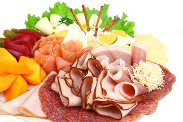 Various mixed meat and vegetable appetizers on white background