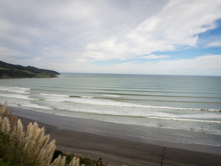 Ngarunui Beach Raglan, New Zealand with Perfect Surfing Surf Waves Lines