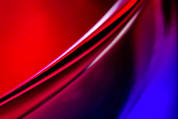Red and blue bright background from liquid in a glass macro, photo