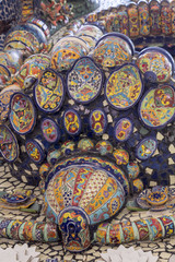 Obraz na płótnie Canvas Mexican talavera style pottery used in altar and fountain. This colorful handmade maiolica have a blurred appearance as they fuse slightly into the glaze. Vibrant colors and unique designs in each one