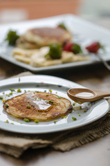Stack of Turkish -style pancakes with pistachio and honey