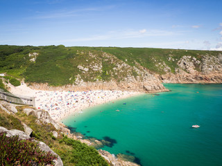Landscape Beach, Aqua Turquoise Blue Sea with People Tourists in the UK Porthcurno Beach