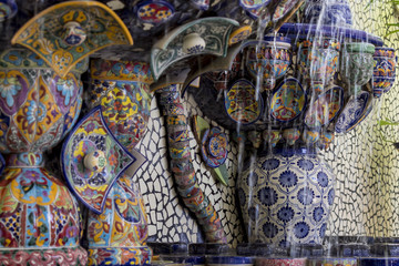 Mexican talavera style pottery used in altar and fountain. This colorful handmade maiolica have a blurred appearance as they fuse slightly into the glaze. Vibrant colors and unique designs in each one