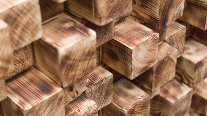 Wooden square bars burned by fire