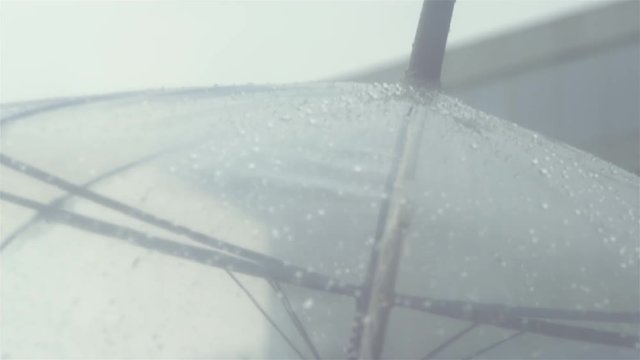 Close up shot of an umbrella on a rainy day