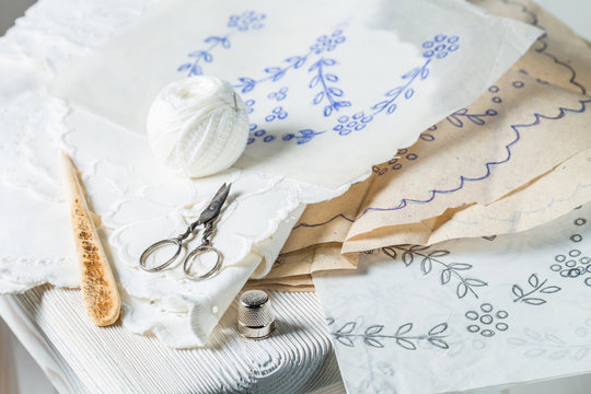Closeup of handmade embroidered napkins with white thread