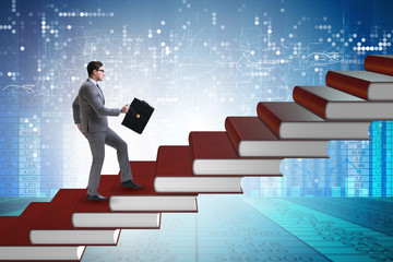 Businessman student climbing the ladder of education books