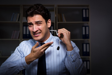 Naklejka premium Tired and exhausted helpdesk operator during night shift