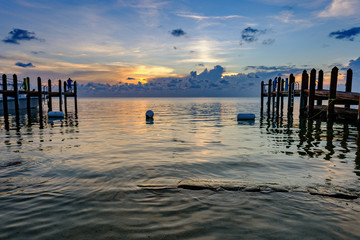 Sunset and clouds with wooden piers in the Florida Keys