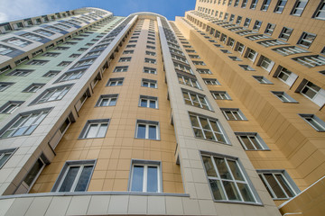 The facade of a modern multi-storey new residential building in Moscow
