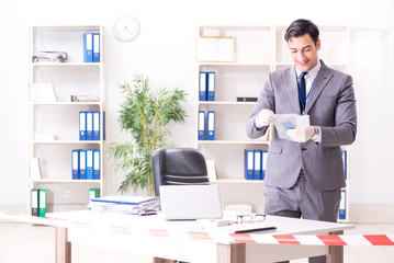 Forensics investigator at the scene of office crime
