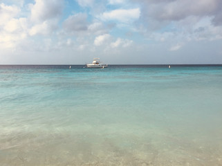 Fototapeta na wymiar boat on ocean landscape near beach