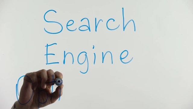 Search engine optimization phrase written on glass, internet marketing strategy