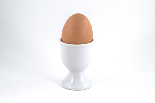 Egg cup with brown soft boiled egg