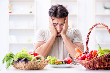 Young man in healthy eating and dieting concept