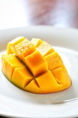 Fresh Juicy Mango on White Plate