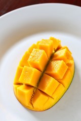 Fresh Juicy Mango on White Plate