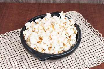 delicious popcorn on the wooden table