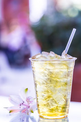 Floral ice tea in a tall glass 