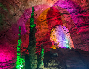 beautiful illuminated multicolored stalactites from karst Reed Flute cave. Guilin Guangxi  China