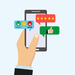 Men's hand keeps modern smartphone with a social network application or instant messenger on the screen. social media concept. Flat style.Sms messenger. Speech bubbles. Phone chat interface.