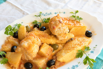 Cod with tomatoes and polenta
