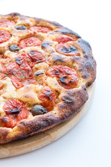 Focaccia typical of Bari Italy with tomatoes and olive