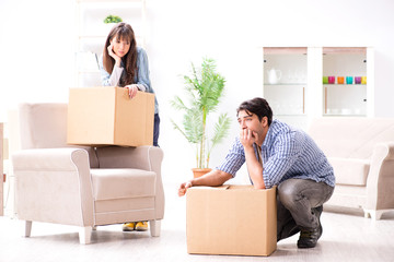 Young family moving in to new apartment after paying off mortgag