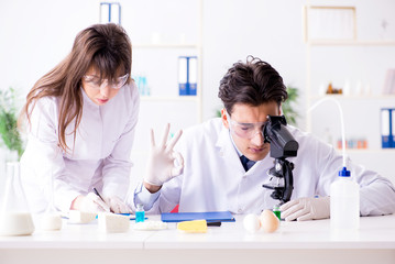 Two lab doctor testing food products