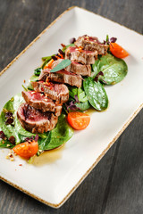 Grilled beef sliced with salad