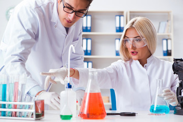 Fototapeta premium Two chemists having discussion in lab