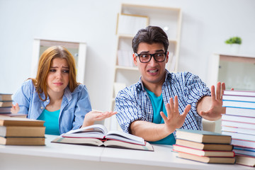 Pair of students studying for university exams