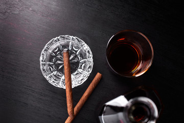 Glass of whiskey with smoking cigar. whisky, tobacco