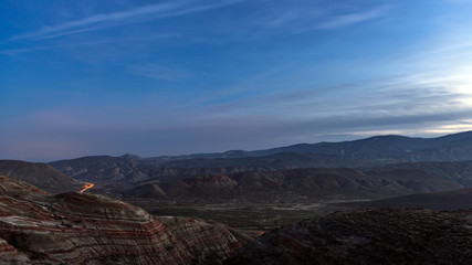 Amazing striped red mountains after sunset