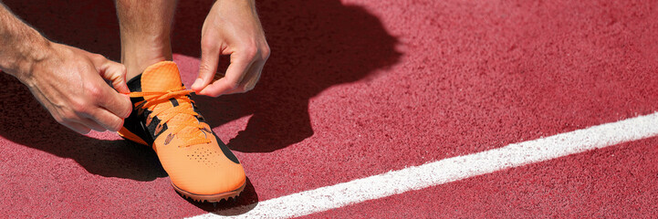 Running shoe at start line success challenge competition banner. Athlete fit man getting ready for...