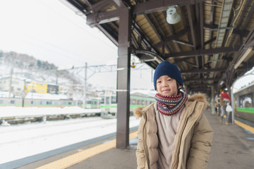 Fototapeta premium Cute asian child at railway station