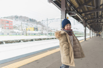 Cute asian child at railway station