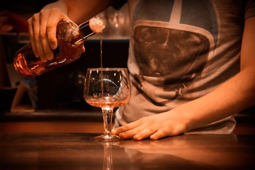 waiter serving alcholica drink in the pub