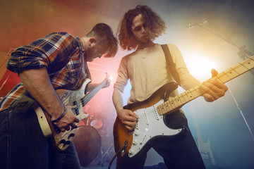 Guitarist and bass player play solo.