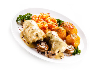 Wrapped pork chop with boiled potatoes and vegetables