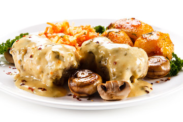 Wrapped pork chop with boiled potatoes and vegetables