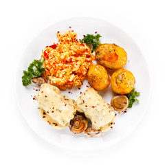Wrapped pork chop with boiled potatoes and vegetables