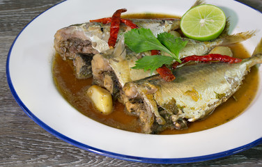 Mackerels in sweet and sour soup with spicy Thai food in white dish