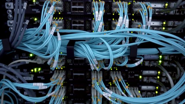 MOSCOW, RUSSIA - March 23: Optical server. Commutator. flashing lights. Optical fiber. Severs computer in a rack at the large data center. Close up. on March 23, 2018 in Moscow, Russia. Editorial