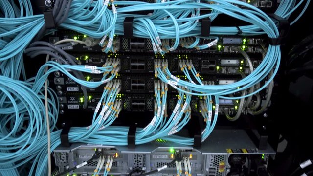 MOSCOW, RUSSIA - March 23: Optical server. Commutator. flashing lights. Optical fiber. Severs computer in a rack at the large data center. Close up. on March 23, 2018 in Moscow, Russia. Editorial