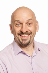 Bald man laughing, close-up, isolated