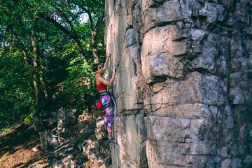 girl climber on a rock.