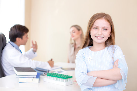 Girl standing at foreground doctor with attractive smiling. People with health care and medical concept.