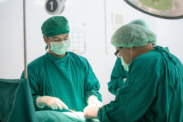 The surgery team working together at the operating room in the hospital.