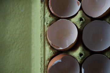 Top view - eggs cartoon box on table, close-up